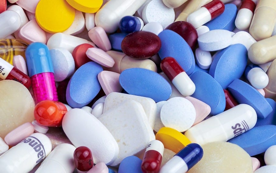 white blue and orange medication pill white blue and orange medication pill