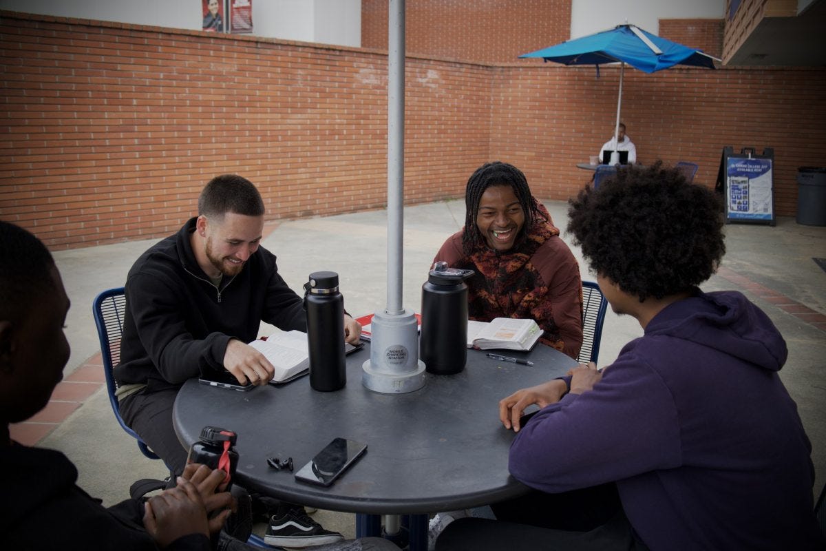 (L-R) Brice Pavlich, 20, undecided, Kobbi Frey, 21, business major and Noel Tekle, 19, business administration major, host bible study outside the Schauerman Library Collaboration Room on Wednesday, April 23. (Kaitlyn Gochez I The Union)