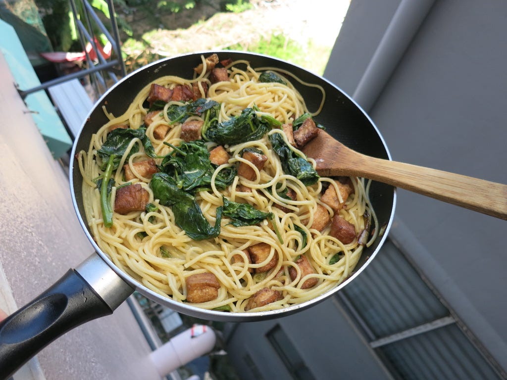 pan of spaghetti and greens