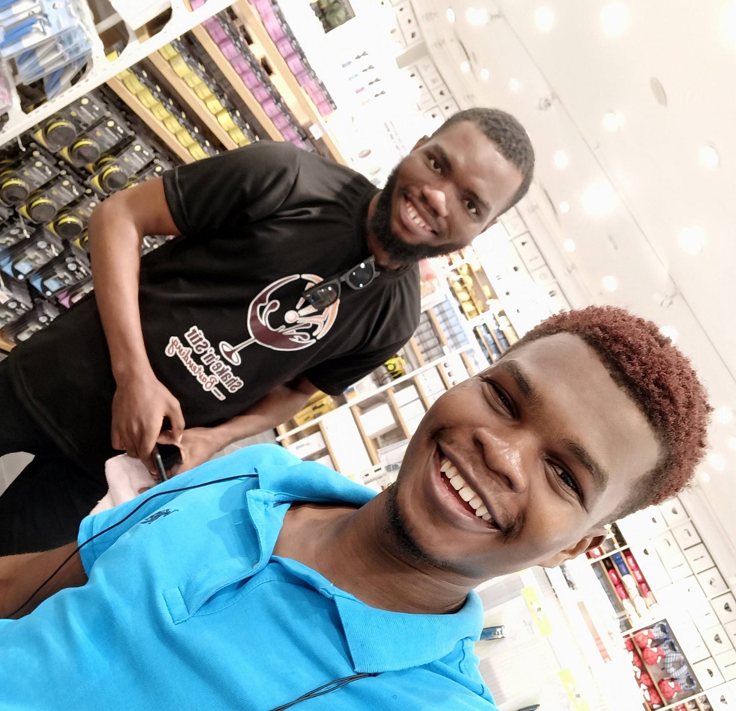 Photo of two black friends: Gideon(left) and Ama (right)