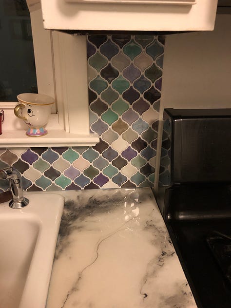 Adhesive backsplash that ended up being the hardest part to puzzle together!