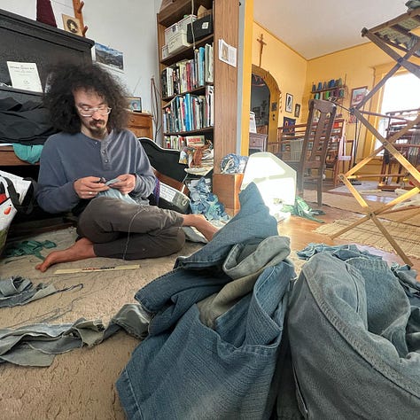 People sewing and spinning as they learn crafts.
