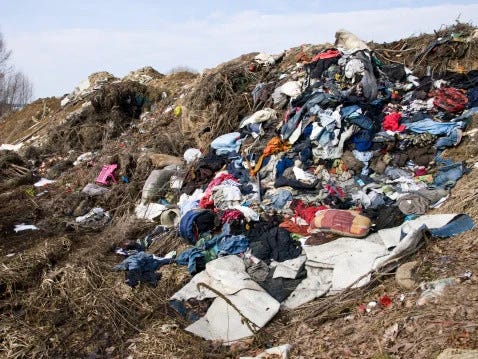 A large number of clothes are dumped openly near the river bank without any proper infrastructure.