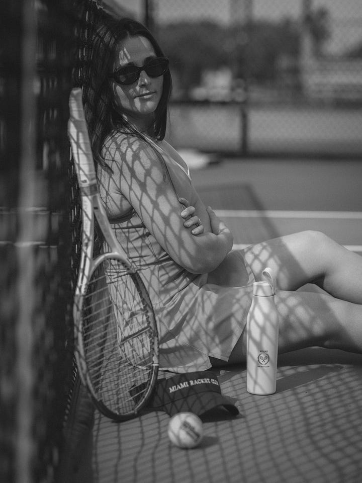A black and white photo series of men and women playing tennis, modeling Miami Racket Club apparel, and chatting courtside. Mix of action shots, posed portraits, and candid moments, showcasing both athleticism and casual club atmosphere.