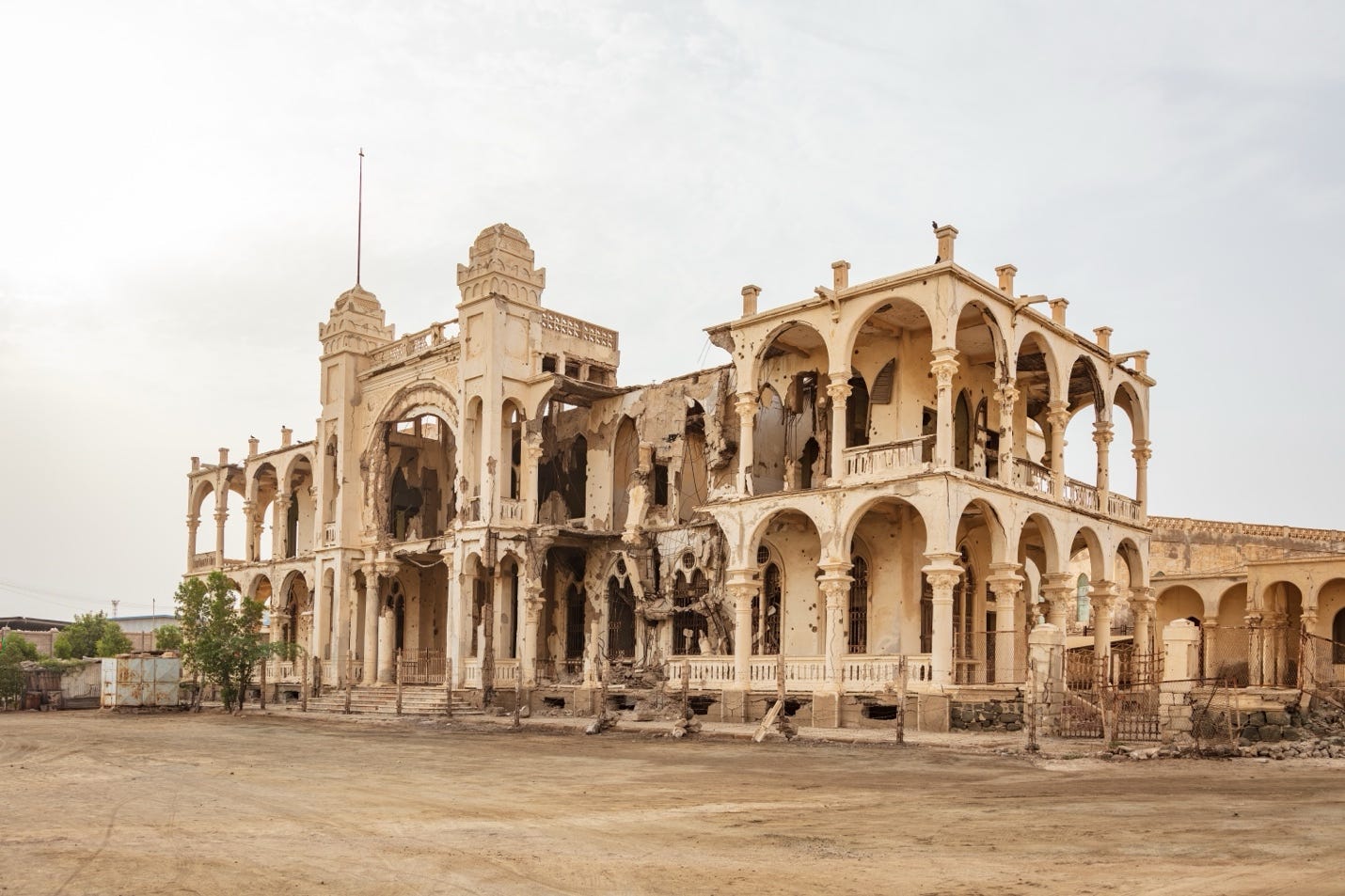 A ruined building with many columns

AI-generated content may be incorrect.