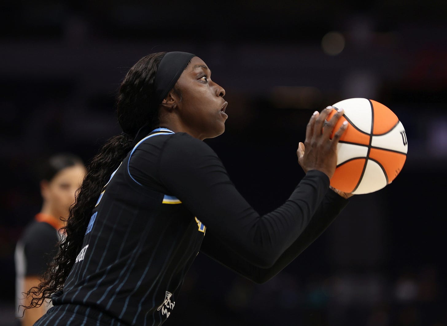 A shot in profile of Kahleah Copper taking a free throw