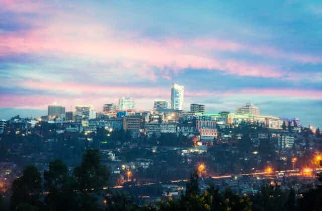 View of Kigali business district with offices, towers and residential homes, at sunset. View of Kigali business district with offices, towers and residential homes, at sunset.
