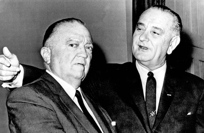 A close-up of men in suits

Description automatically generated