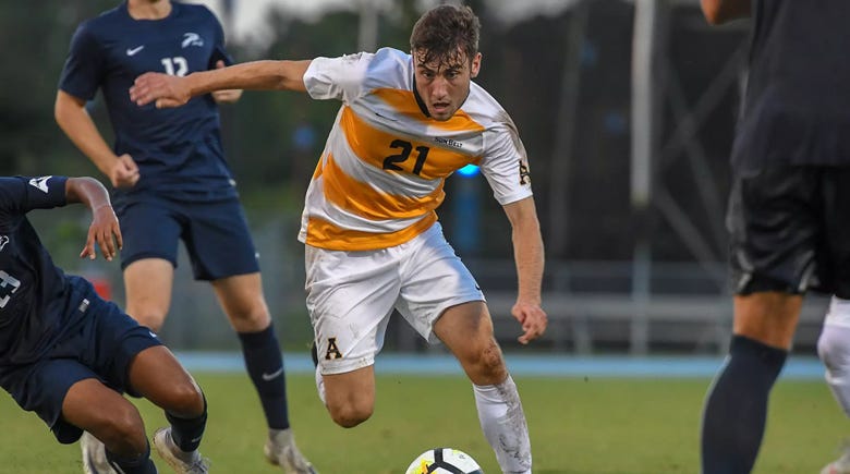 A person in a football uniform kicking a football ball
AI-generated content may be incorrect. A person in a football uniform kicking a football ball
AI-generated content may be incorrect.