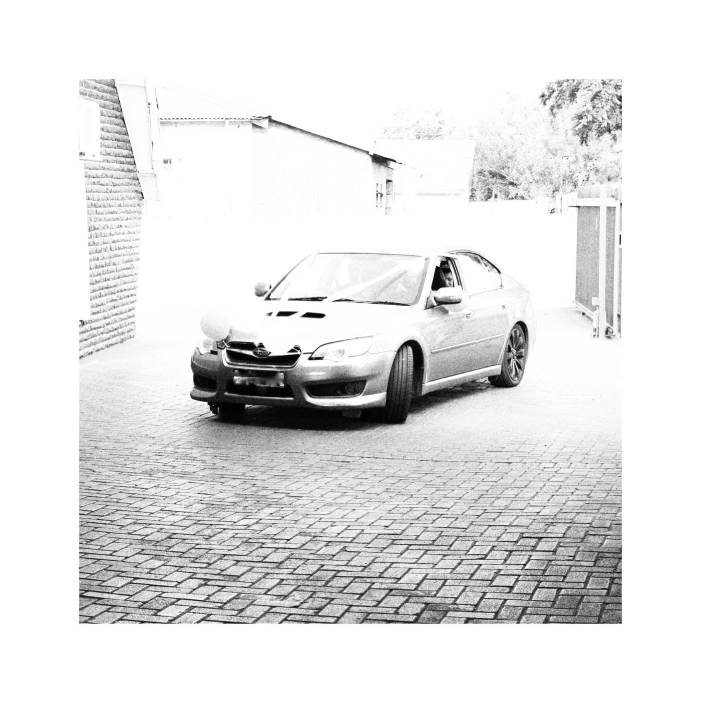 A photo of a car at a church.