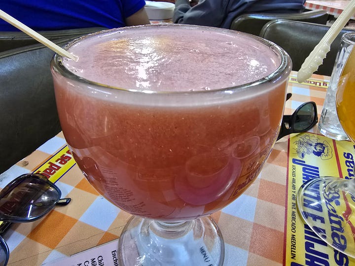 Watermelon agua fresca, cream soup, rice with egg, mole with chicken