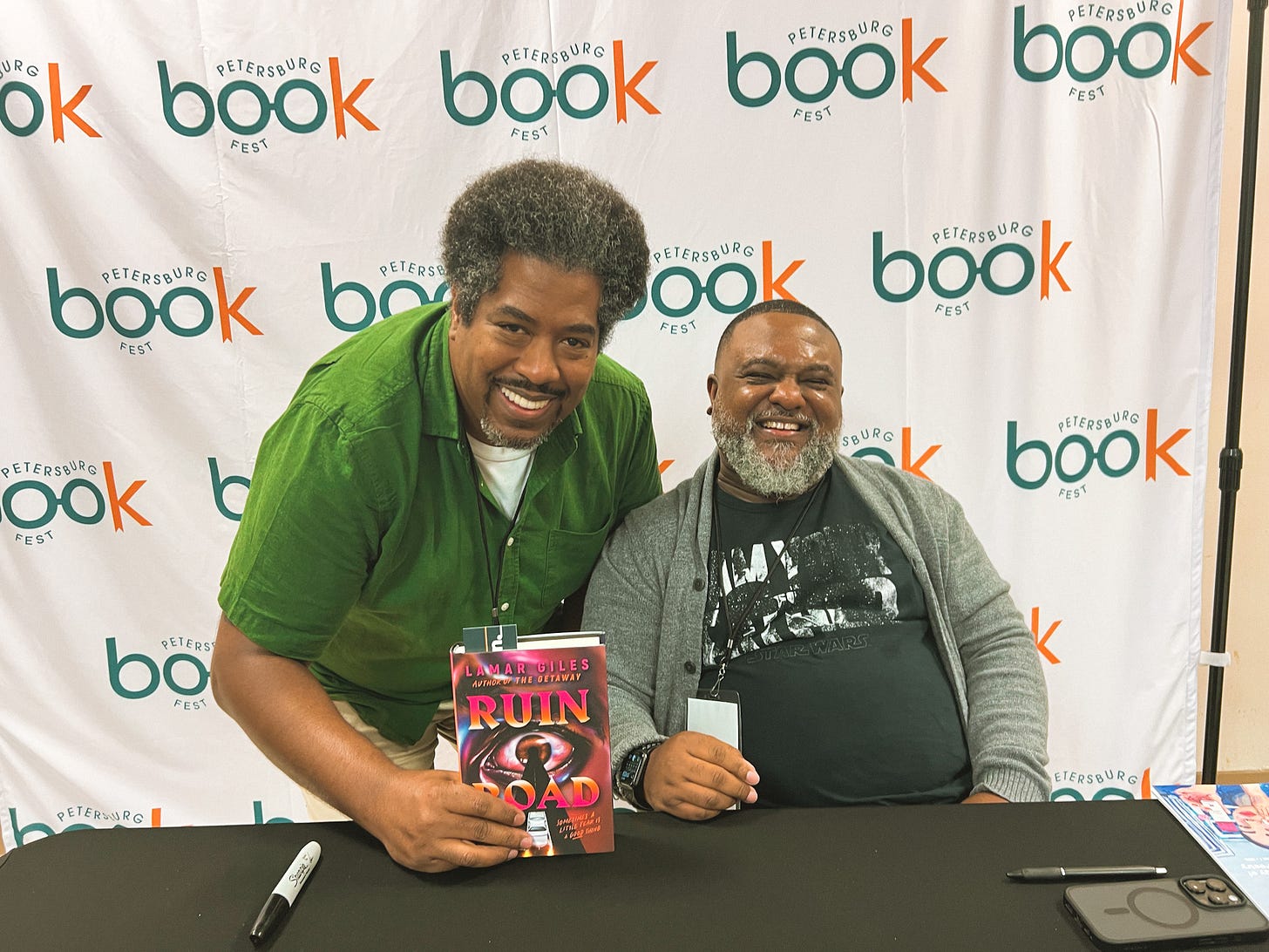 Authors Jor-El Caraballo and Lamar Giles at book signing at Petersburg Book Fest September 2025