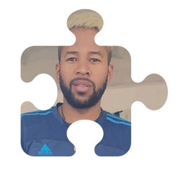 A person with a beard wearing a blue shirt

AI-generated content may be incorrect.
