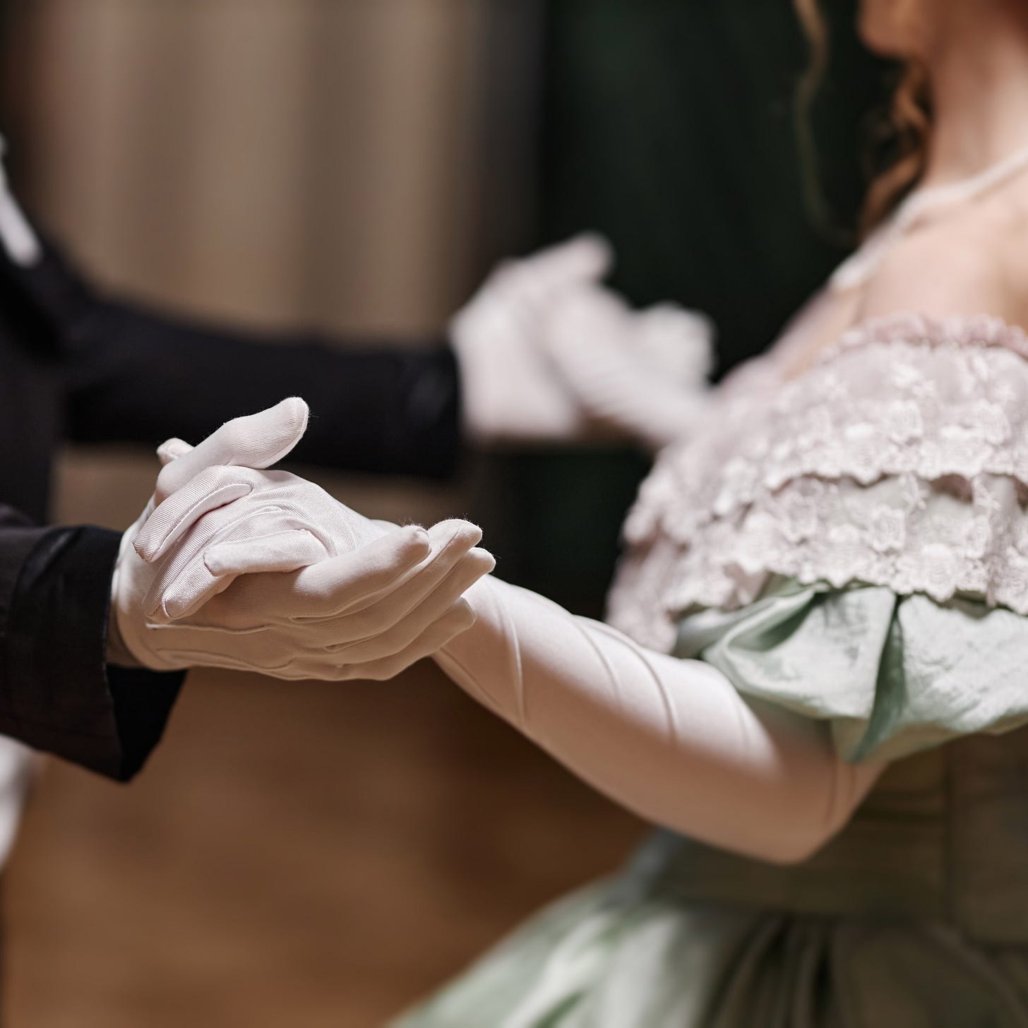 I'd be happy to help you write alt-text for these images. Image 1 (dancing.png): "Close-up of a couple in formal attire dancing together. The woman wears long white gloves and holds a bouquet of white flowers with greenery. The man wears a dark suit. Their hands are clasped in a traditional ballroom dance position.