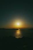 The sun setting over the sea. The sun setting over the sea.