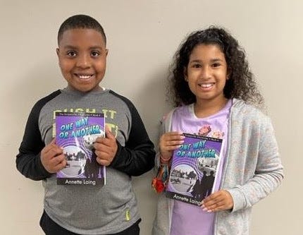 Kids holding books