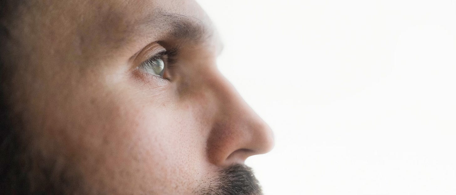 close up of eyes of a man looking into distance