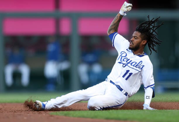 Maikel Garcia of the Kansas City Royals slides into second base for a double during the 1st inning of the game against the Seattle Mariners at...