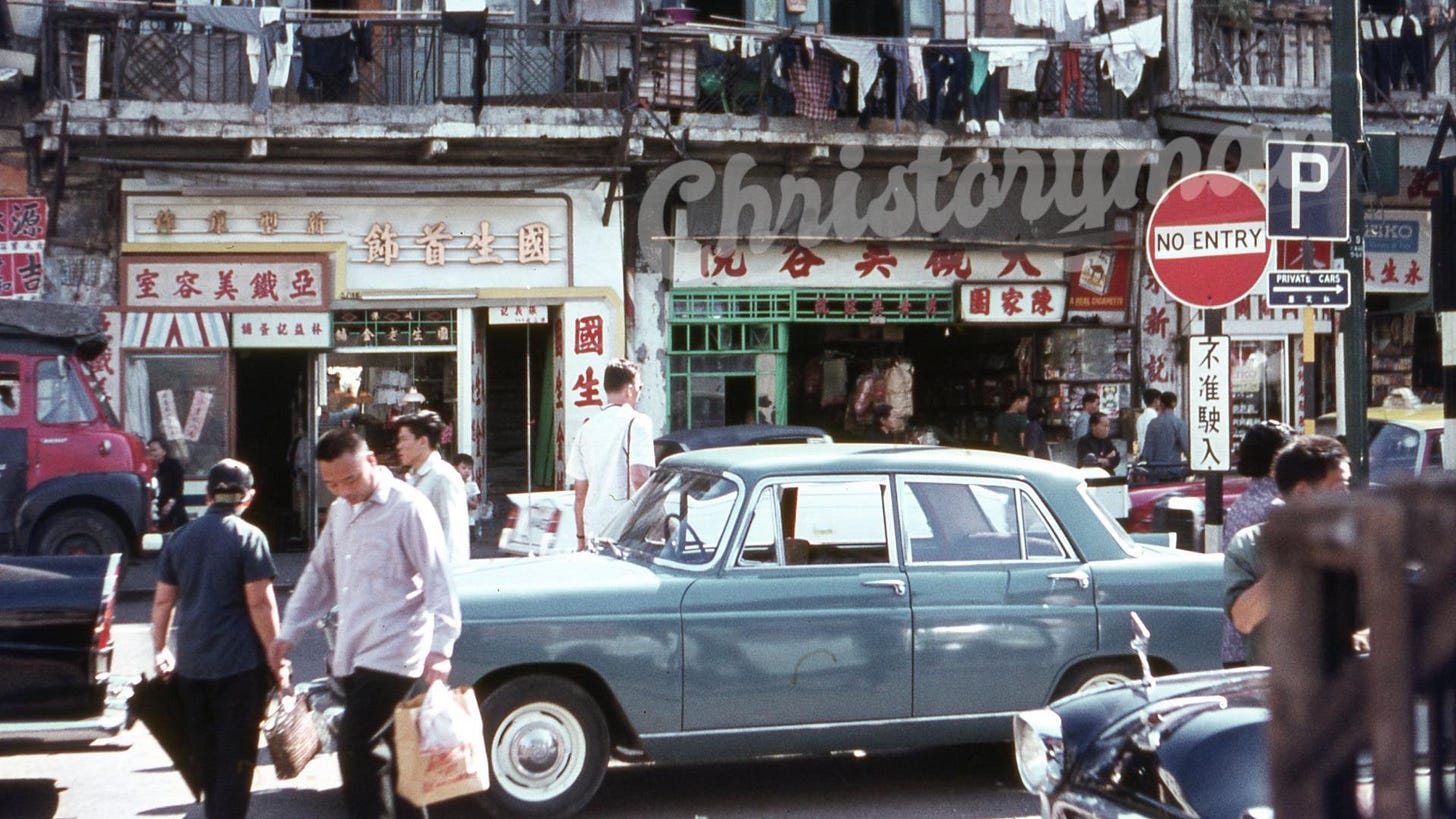 A bustling street view captures the vibrant life of Hong Kong, then a Crown Colony, in 1966.