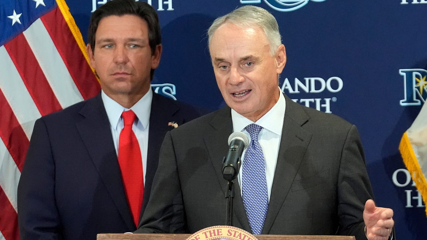 Major League Baseball commissioner Rob Manfred, right, speaks during a new baseball stadium news conference as Florida Gov. Ron DeSantis looks, Tuesday, Feb. 3, 2026, at Hillsborough College in Tampa, Fla. (AP Photo/Chris O'Meara) Major League Baseball commissioner Rob Manfred, right, speaks during a new baseball stadium news conference as Florida Gov. Ron DeSantis looks, Tuesday, Feb. 3, 2026, at Hillsborough College in Tampa, Fla. (AP Photo/Chris O'Meara)
