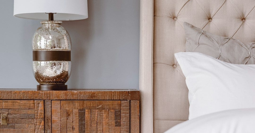white table lamp on brown wooden drawer