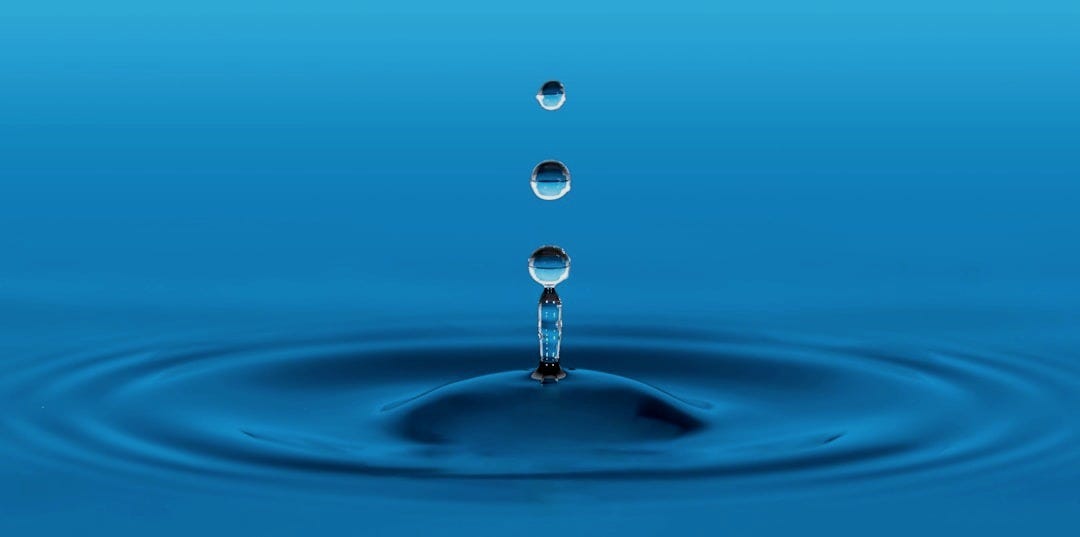 water drop in blue water