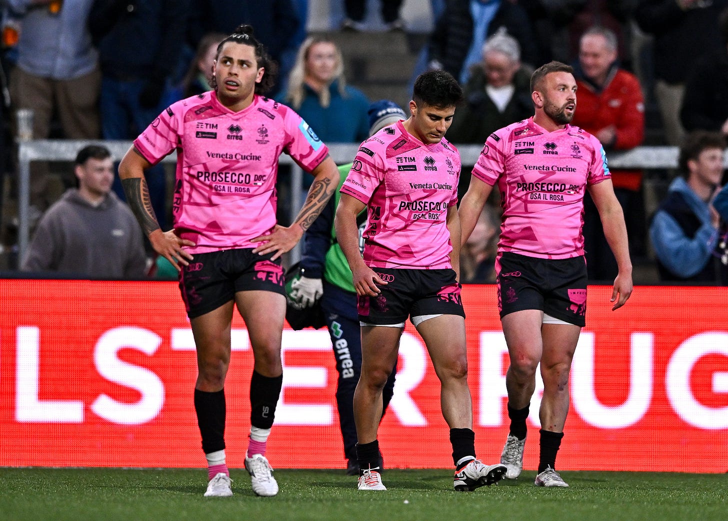 Benetton players, from left, Jacob Umaga, Tomas Albornoz and Andy Uren react after their side concede their fourth try during the United Rugby Championship match between Ulster and Benetton at Kingspan Stadium in Belfast
