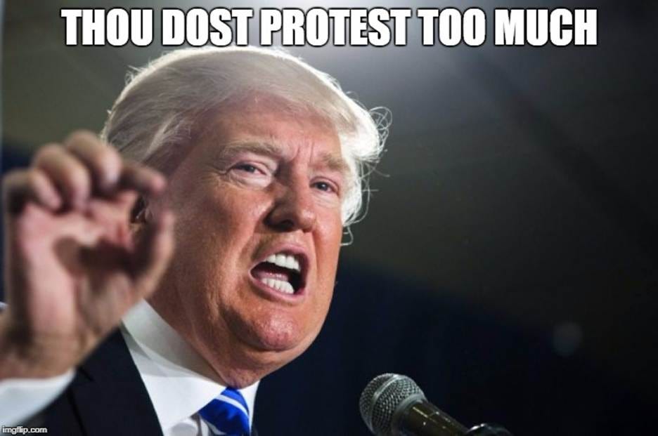 A person in a suit and tie speaking into a microphone

AI-generated content may be incorrect.