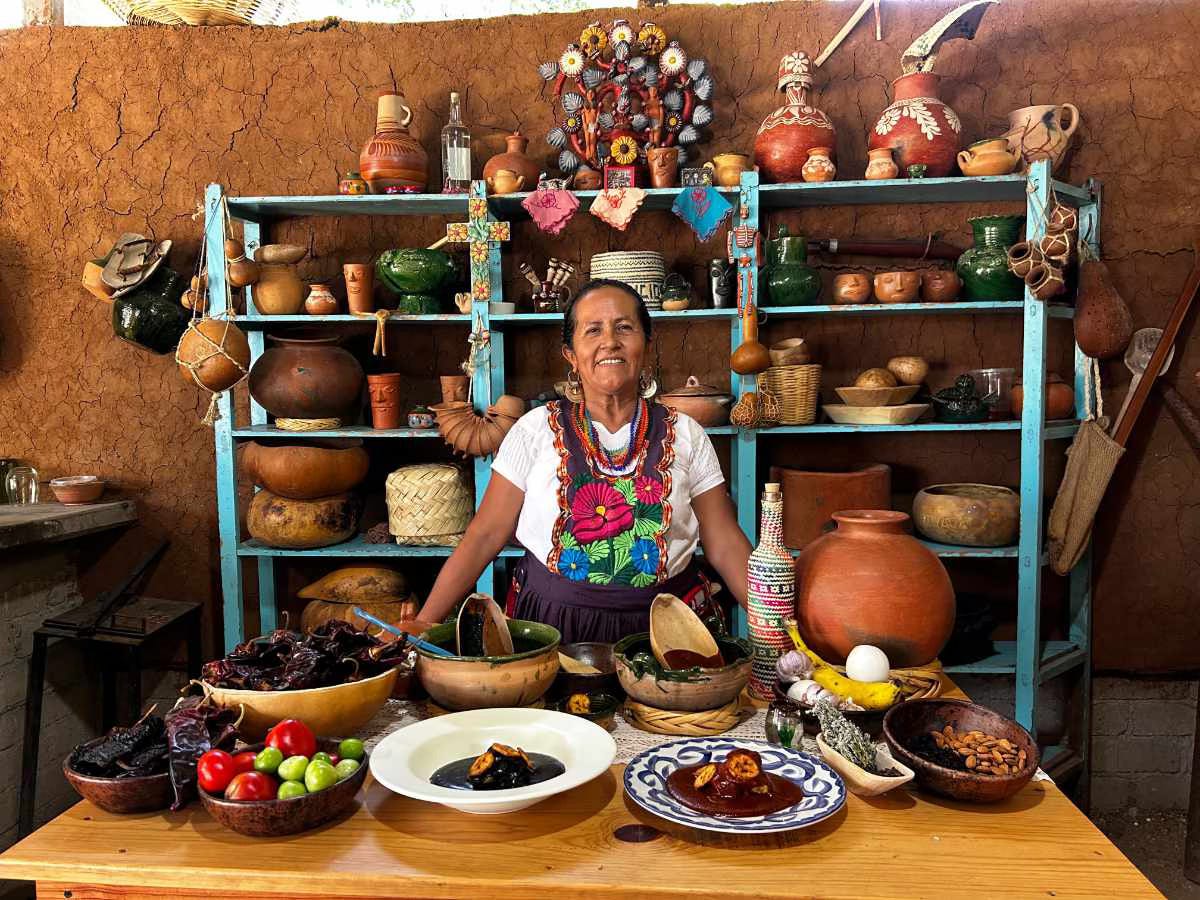 Petra Valencia Velasquez with traditional Oaxacan dishes