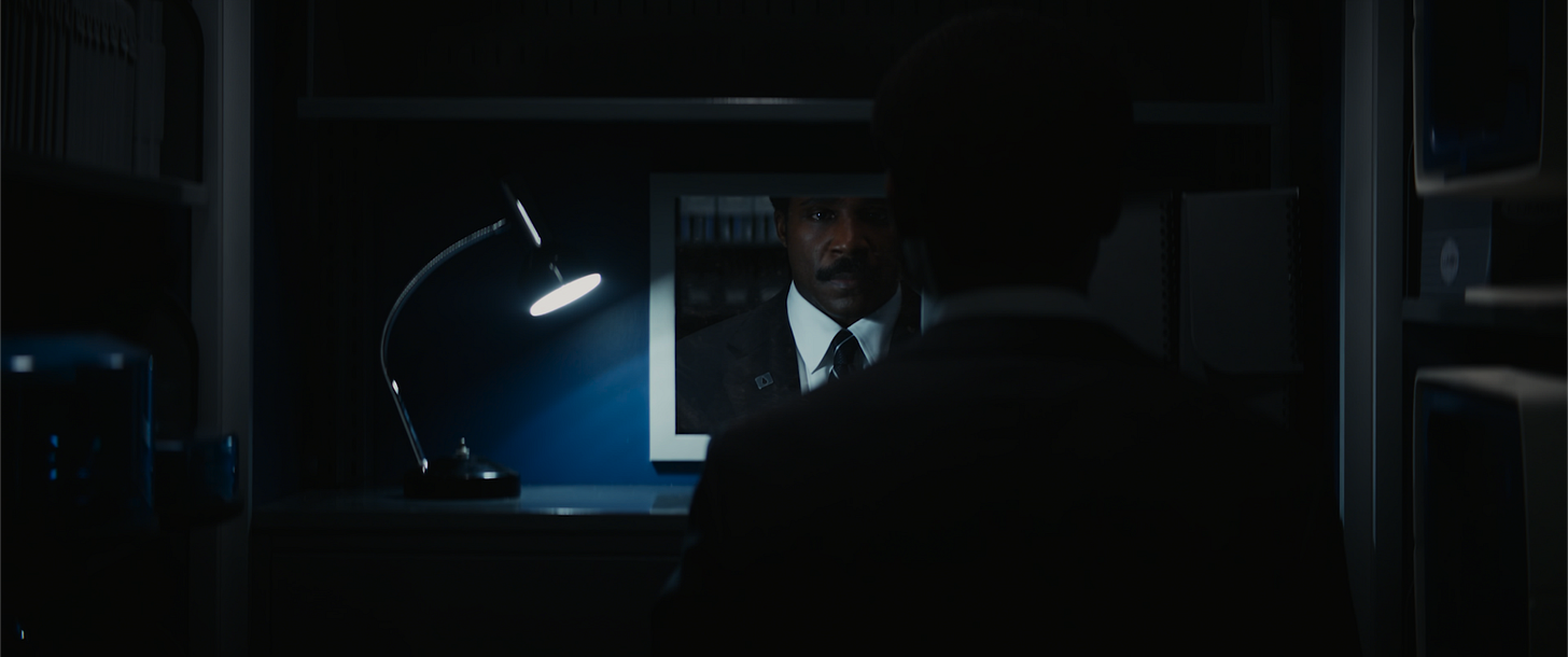 Milchick staring into the mirror