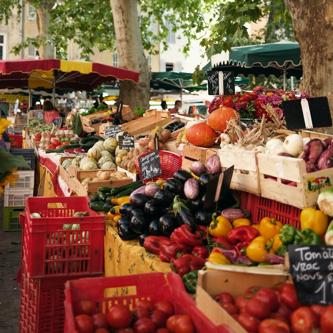 fruit stand on the street during daytime fruit stand on the street during daytime