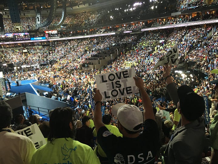 My Journey with Bernie book, DNC 2016, Independence Hall, Green glow-in-the-dark shirts, 2016 DNC Delegate Badge, Delegates, Protestors, and Volunteers in Philadelphia, Lighted FEEL THE BERN Shirt