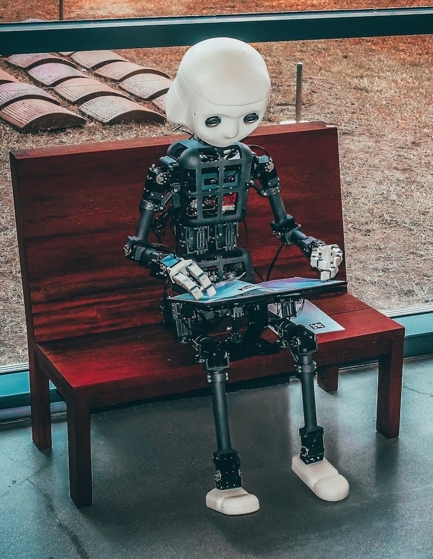 black and white robot toy on red wooden table
