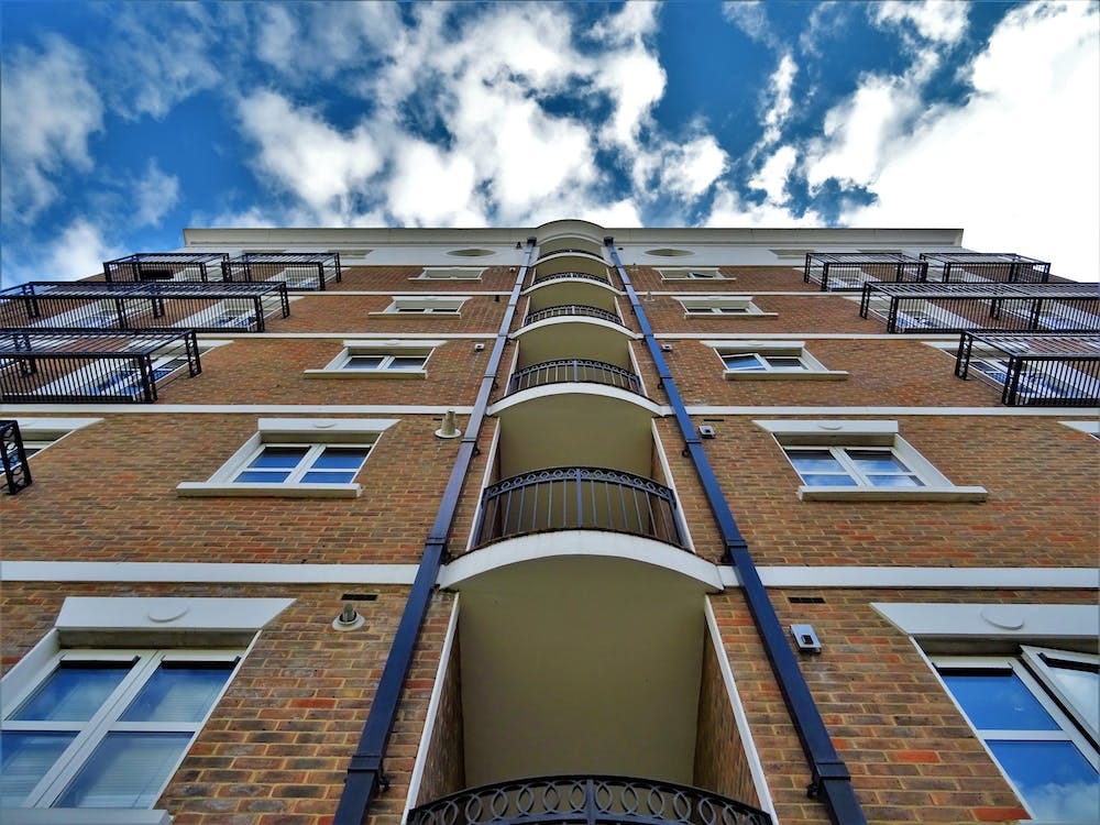 Free Low Angle Photography of Brown Brick Building Stock Photo