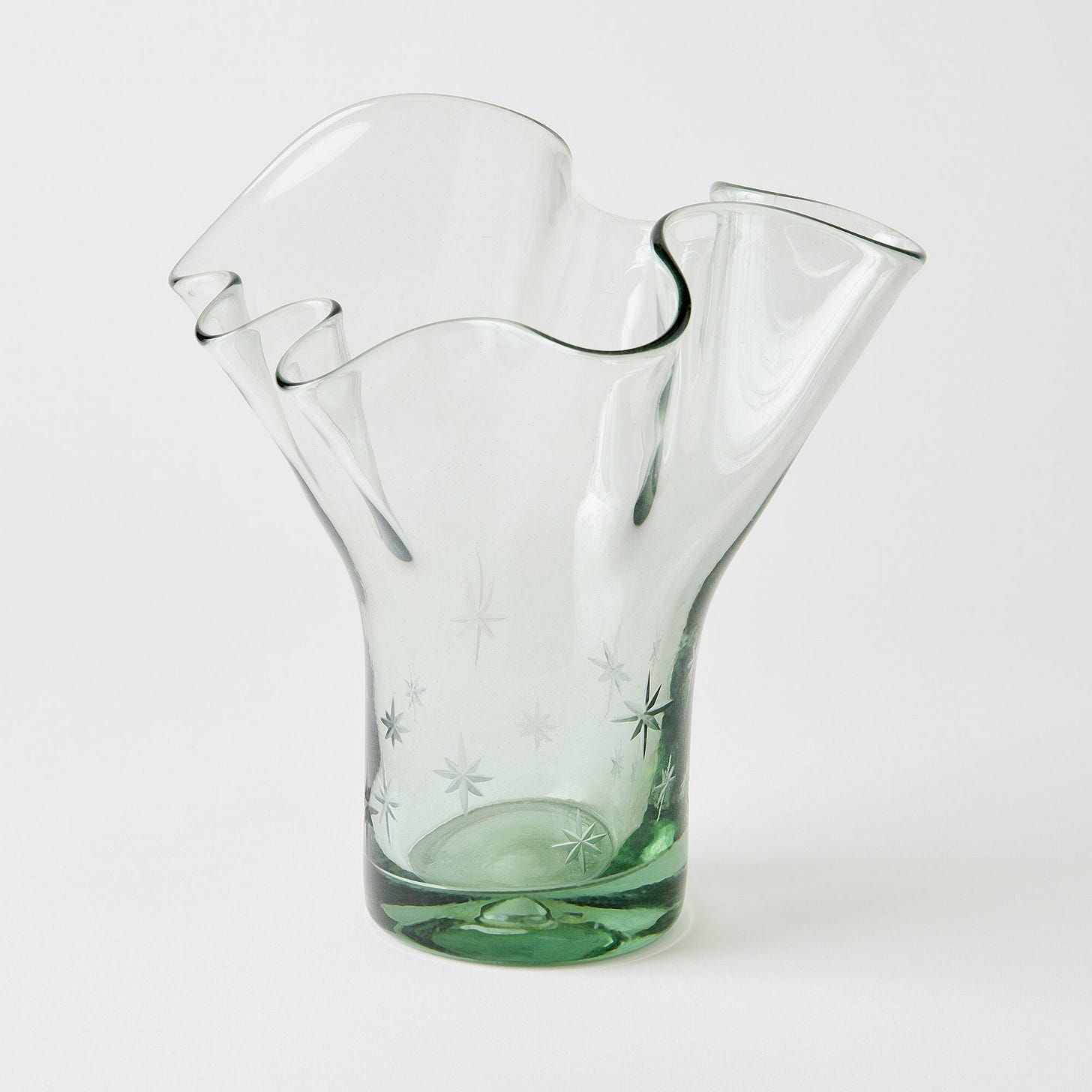 Glass vase with a unique star design on a white background Glass vase with a unique star design on a white background