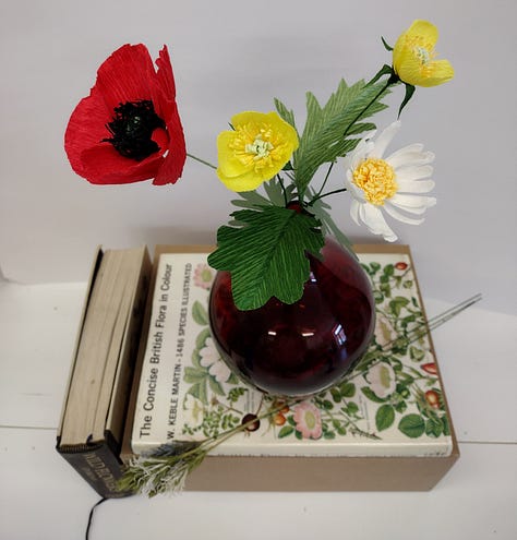 A range of different paper flowers from brightly coloured fantasy flowers to detailed wildflowers