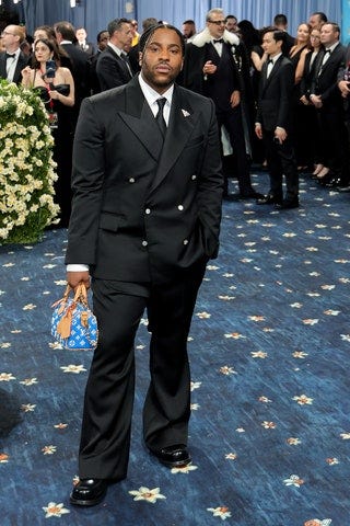 Image may contain Skepta Jeff Goldblum Mitra Hajjar Baldur Brönnimann Anais Granofsky Clothing Formal Wear and Suit