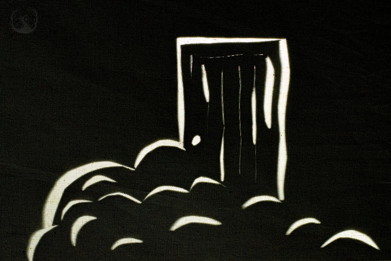 A shadow cut-out depicting a door and fog in front of the door. Credit: Lucas Van Wyk Joel