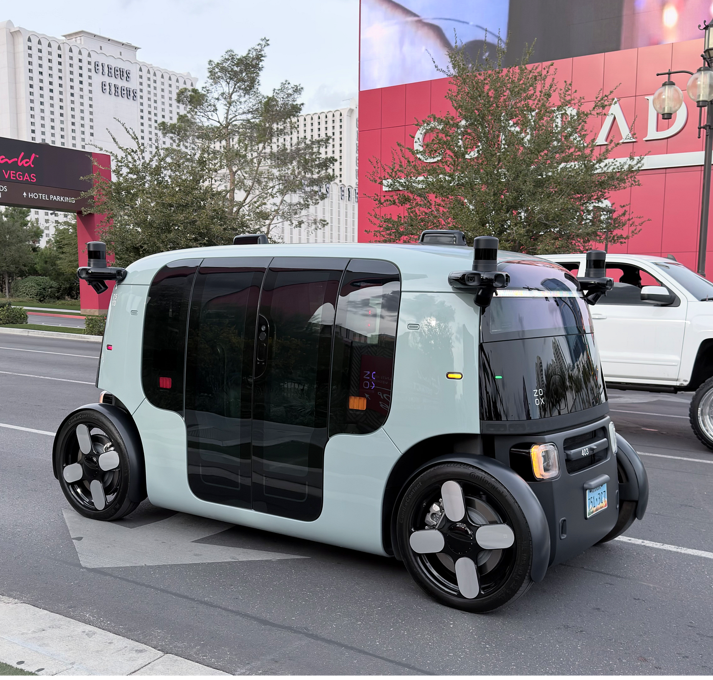 A white and black vehicle on a street

AI-generated content may be incorrect.