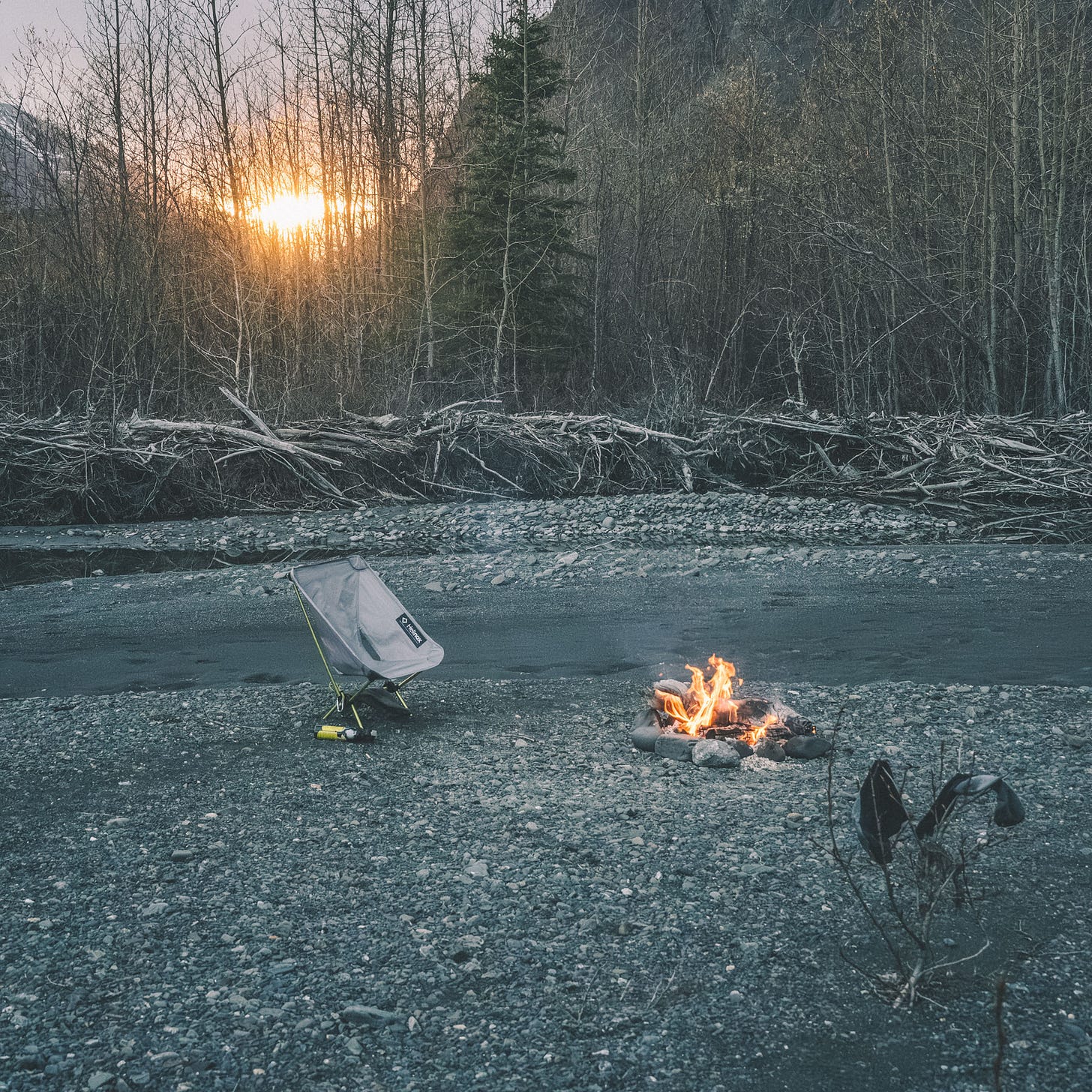 Campfire and folding camp chair.