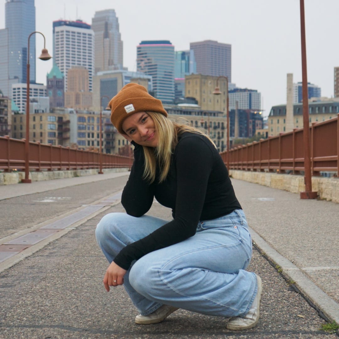 Picture shows Lisa on stone arch bridge in Minneapolis