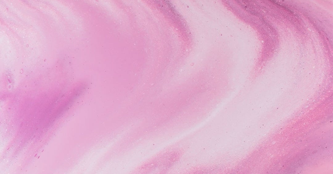 a close up of a pink and purple substance