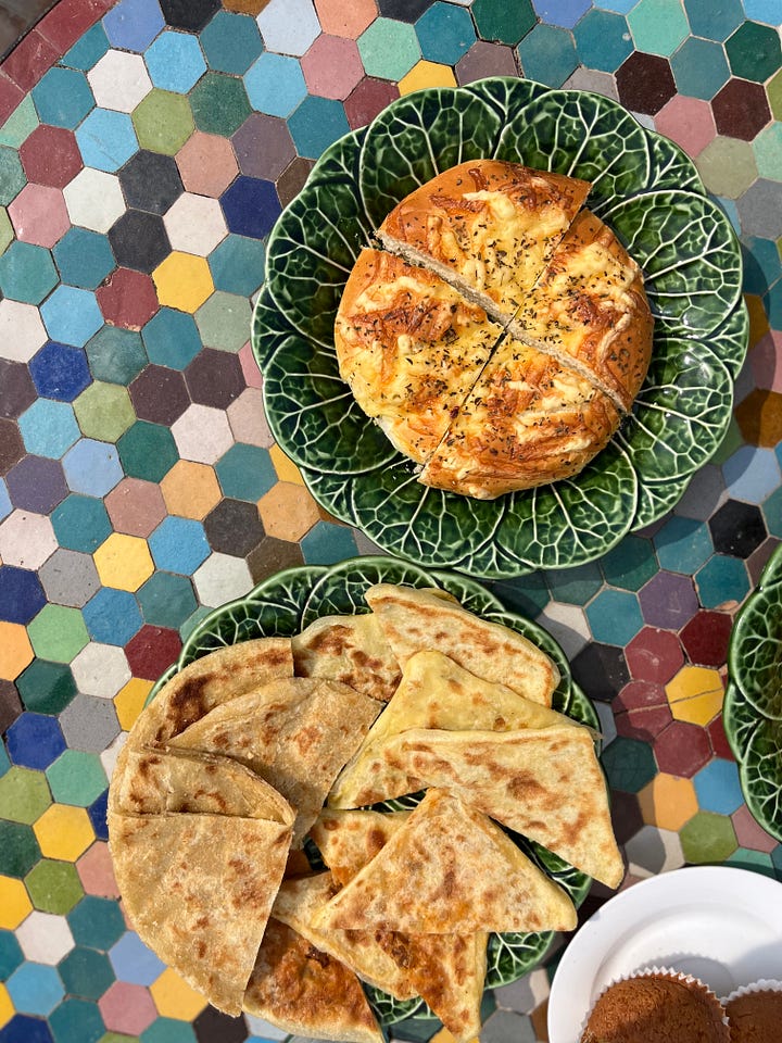 A picture of some round moroccan flat breads, a picture of me drinking mint tea and the choux bun filled with whipped cream and chocolate pouring over the top