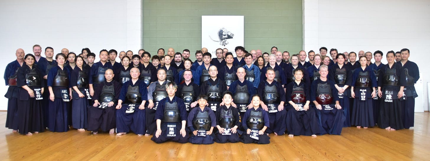 A group of people posing for a photo

AI-generated content may be incorrect.