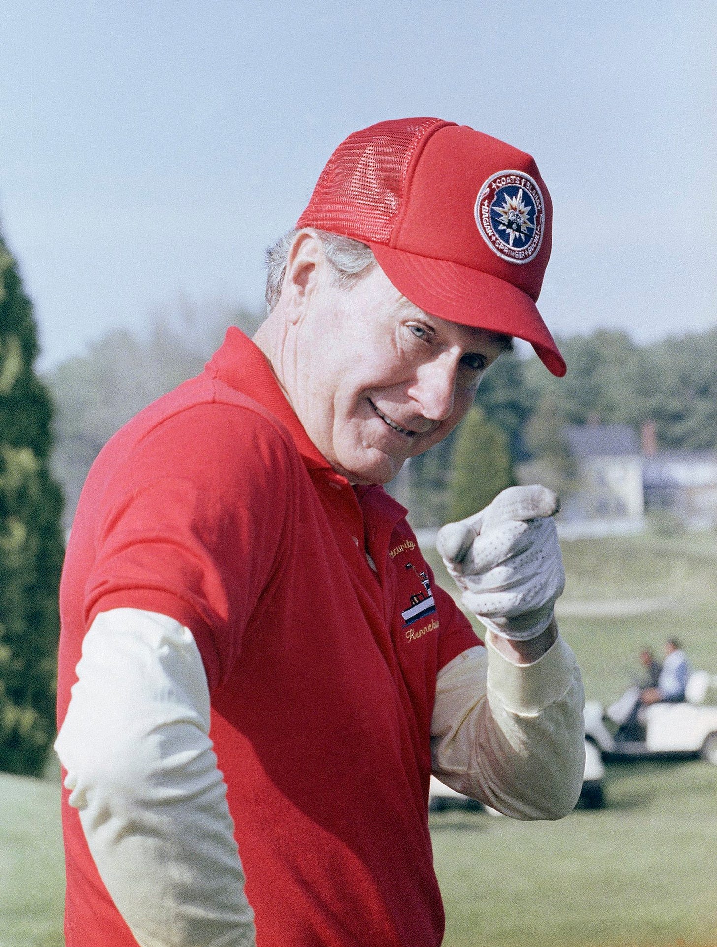 President George H.W. Bush playfully gestures at photographers during a golf round at Cape Arundel Golf Club in Kennebunkport, Maine, May 26, 1990, during his holiday weekend vacation. President George H.W. Bush playfully gestures at photographers during a golf round at Cape Arundel Golf Club in Kennebunkport, Maine, May 26, 1990, during his holiday weekend vacation.