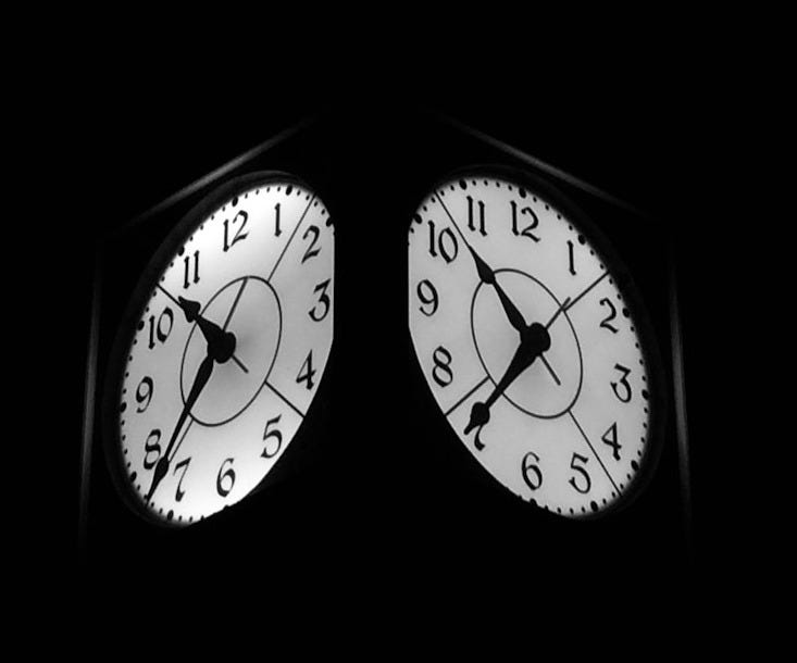 black clock displaying 7:52