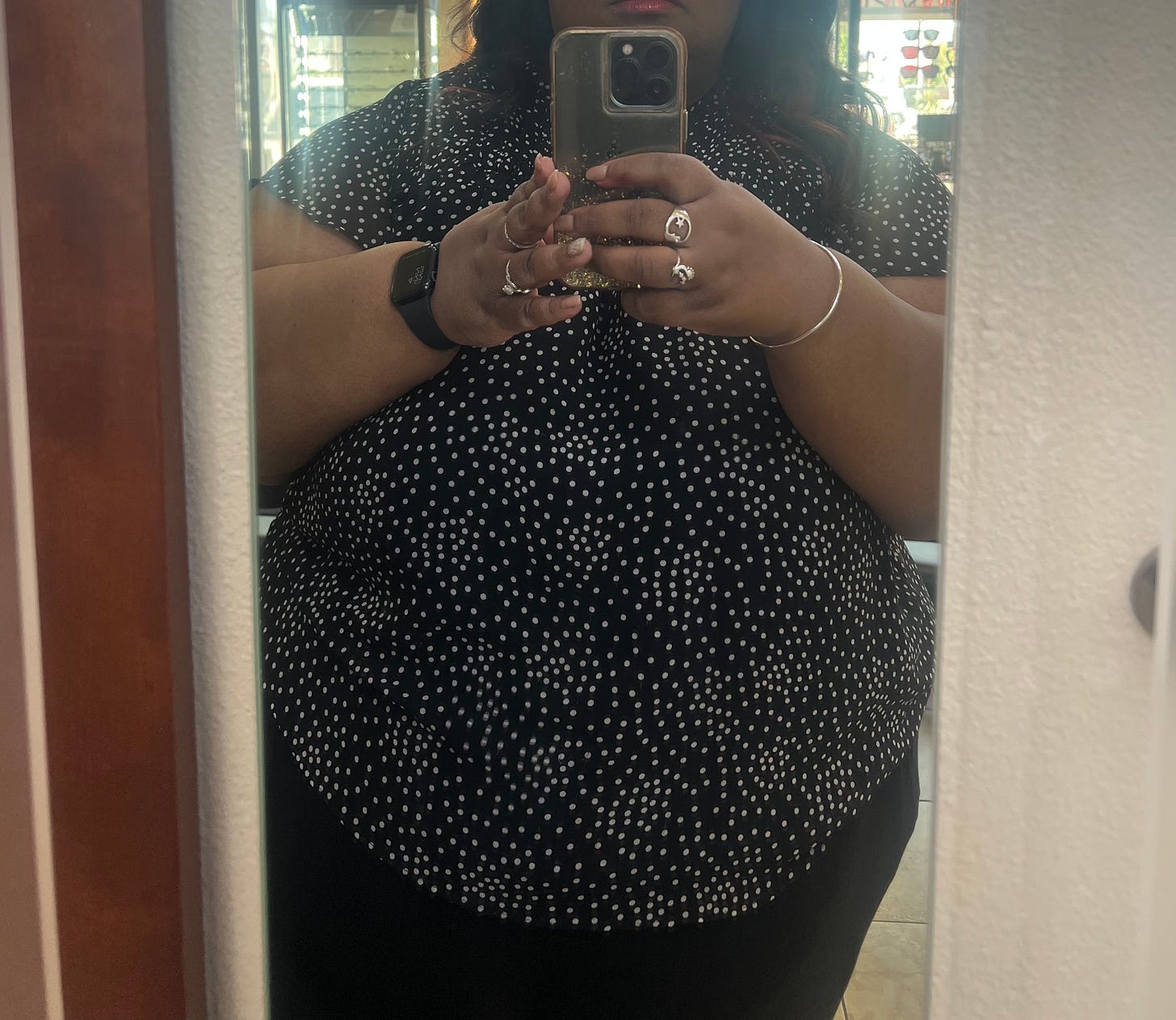 Photograph of the author’s body reflected in a mirror, cropped to the torso, holding a phone. Photograph of the author’s body reflected in a mirror, cropped to the torso, holding a phone.