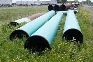 Pipeline used to carry crude oil sits at the Superior, Wis., terminal of Enbridge Energy, June 29, 2018. (AP Photo/Jim Mone, File) Pipeline used to carry crude oil sits at the Superior, Wis., terminal of Enbridge Energy, June 29, 2018. (AP Photo/Jim Mone, File)