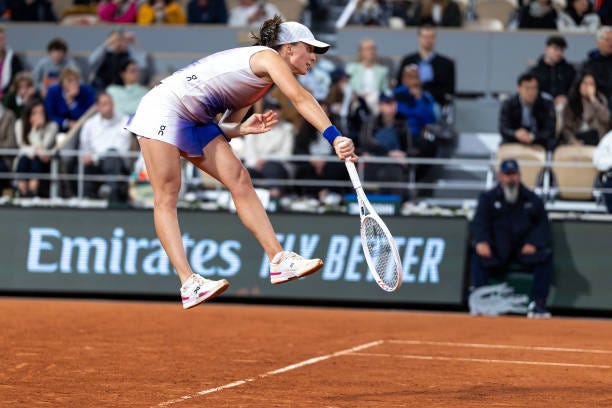 Iga Swiatek of Poland serves against Naomi Osaka of Japan on Court Philippe-Chatrier during the second round of the 2024 French Open Tennis... Iga Swiatek of Poland serves against Naomi Osaka of Japan on Court Philippe-Chatrier during the second round of the 2024 French Open Tennis...