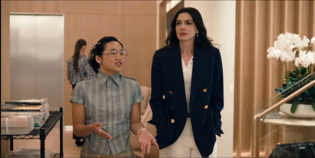 In this photograph, the character Jin Chao appears alongside Hathaway. In this photograph, the character Jin Chao appears alongside Hathaway.